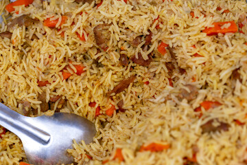 Pilaf with a spoon close-up