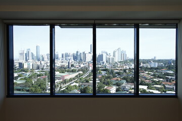 View from a window: a residential area beside a business district with high rise buildings