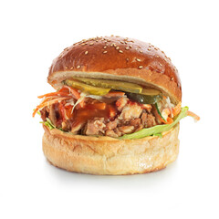 Pulled kebab burger with lettuce on a healthy wholewheat bun over a white background