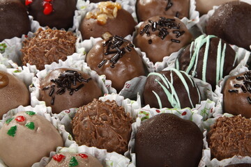 Assorted chocolate cream puffs in various flavors
