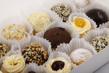 Assorted cream puffs in different flavors