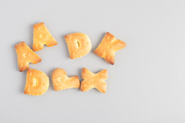 English letter bread snack on gray background