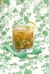 Mojito on a pattered leafy background