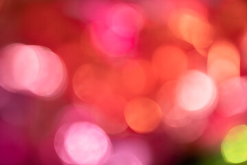 Blurred bokeh background for Christmas and New Year holiday. Abstract colorful wallpaper with defocused lights. Copy space