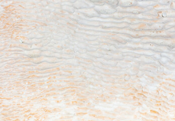 White volcanic limestone rock as background.