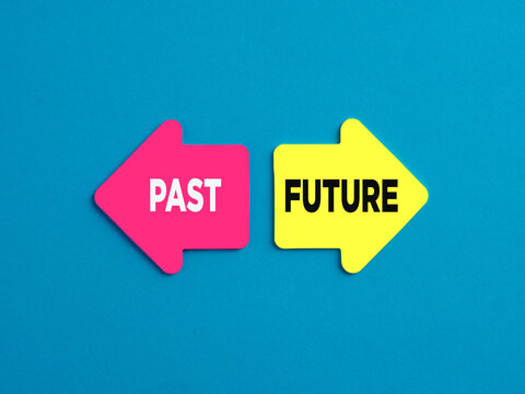 The Dilemma Between Living In The Past Or Moving Forward To The Future. The Words Future And Past On Arrows Pointing On Opposite Directions