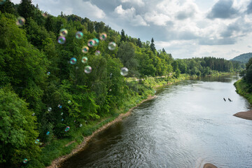 flying bubbles over river
