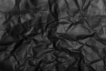 black paper texture background crumpled pattern 