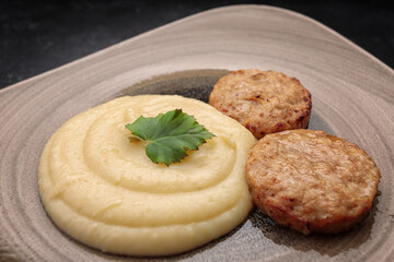 Steamed meat cutlets with boiled mashed potatoes