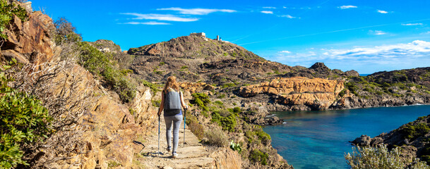 Woman walking on path- Costa brava in Spain