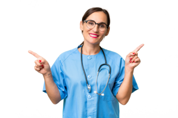 Middle-aged nurse woman over isolated background pointing finger to the laterals and happy
