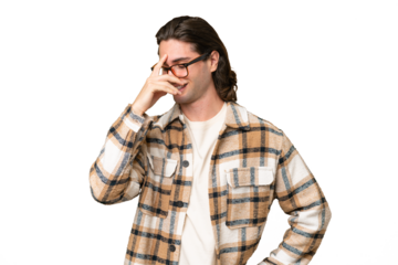 Young caucasian man isolated on green chroma background laughing