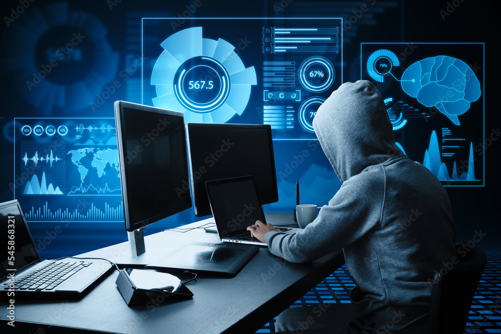 Poster Side view of hacker at desktop using computers with abstract glowing blue business charts and graphs hologram on dark background. Innovation, hacking, future and fintech concept.