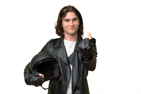 Young handsome man with a motorcycle helmet isolated on green chroma background doing coming gesture