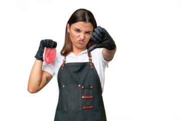 Butcher woman wearing an apron and serving fresh cut meat isolated on green chroma background showing thumb down with negative expression