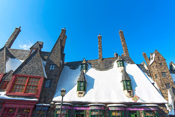Fototapeta premium OSAKA - JAN 10: Roofs of houses covered by snow in Hogsmeade Village of Harry Potter themed attractions at Universal Studios Adventure theme park in Osaka on January 10. 2017 in Japan