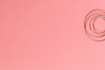 Fototapeta na wymiar Women's bijouterie on pink background, object shot