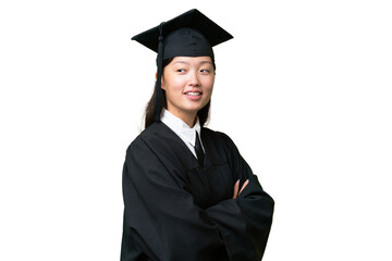 Young university graduate Asian woman over isolated background with arms crossed and happy