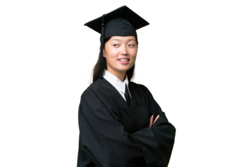 Young university graduate Asian woman over isolated background with arms crossed and happy