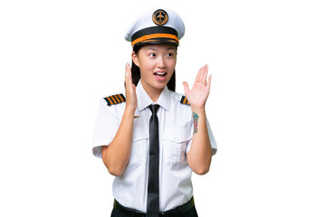 Airplane pilot Asian woman over isolated background with surprise facial expression