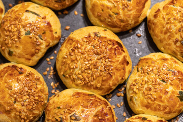 Sesame bun. Pogaca in a tray. close up