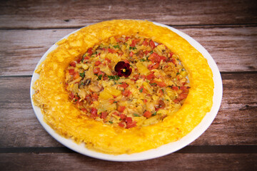 Recipe Omelette with peppers, onions, tomatoes, courgettes and coriander. High quality photo