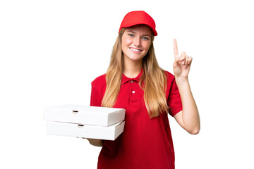 Young caucasian pizza delivery woman with work uniform picking up pizza boxes over isolated background pointing up a great idea