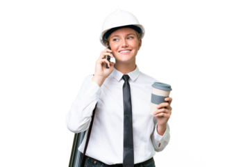 Young architect caucasian woman with helmet and holding blueprints over isolated background holding coffee to take away and a mobile