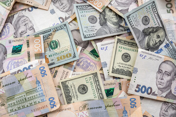 Fototapeta na wymiar Ukrainian hryvnia with American dollars as business background