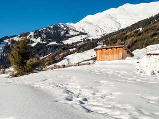 Panoramic view with wood house in winter in resort Ladis, Fiss, Serfaus in ski resort in Tyrol.