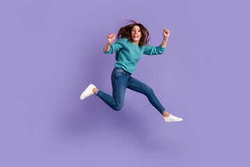 Fototapeta na wymiar Full body photo of young excited woman celebrate victory fists hands awesome luck isolated over violet color background