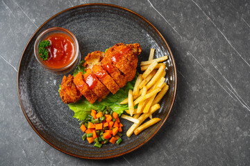 A chicken cordon bleu or schnitzel cordon bleu is a dish of meat wrapped around cheese (or with cheese filling), then breaded and pan-fried or deep-fried.