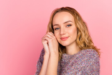 Beautiful and tender girl without makeup smiling and looking at something adorable cute isolated pink background