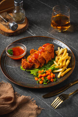 A chicken cordon bleu or schnitzel cordon bleu is a dish of meat wrapped around cheese (or with cheese filling), then breaded and pan-fried or deep-fried.