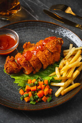 A chicken cordon bleu or schnitzel cordon bleu is a dish of meat wrapped around cheese (or with cheese filling), then breaded and pan-fried or deep-fried.