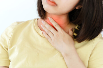 A woman's sore throat has red areas due to illness. Health care concept.