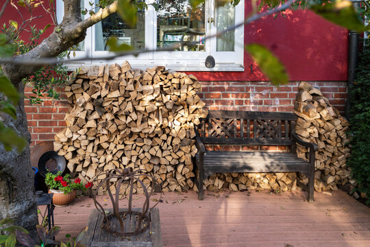 Stack of firewood stored in back yard