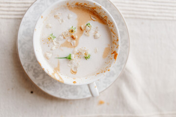 spring. coffee with milk with blossom flowers