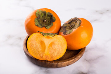 persimmon on a marble background