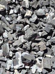 evocative image texture of lit charcoal
