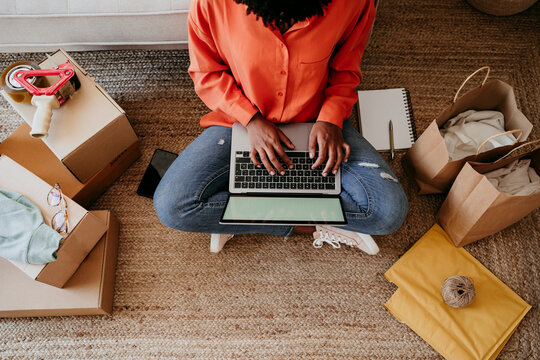 Young freelancer working on laptop at home office