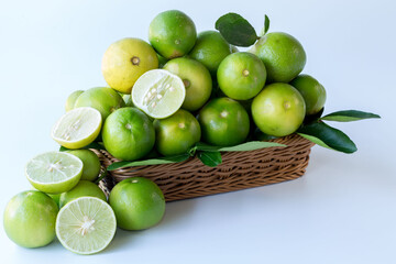 Fresh green lemons, in basket , Fresh green lemons at market and shop for sell..