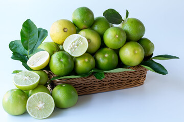 Fresh green lemons, in basket , Fresh green lemons at market and shop for sell..
