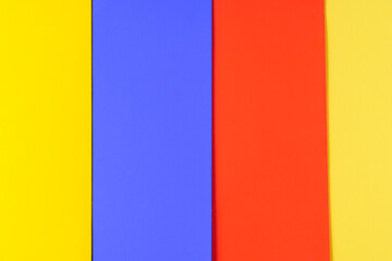Background of blue,yellow and red paper in bright colors, geometric pattern.