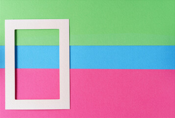 White frame on over pink,green,blue pastel background, the concept of minimalism