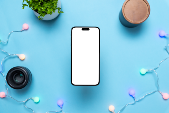 Phone above blue table with holiday colorful light bulbs. Isolated, transparent display for copy or app presentation. Concept of birthday invitations or card