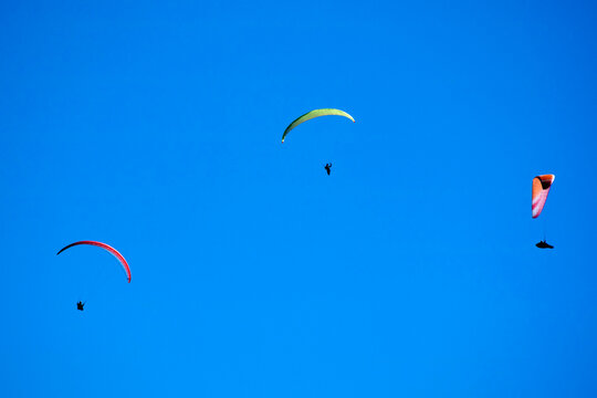 Photo Shoot Of The Flight Of A Paragliding Group