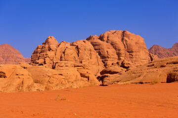 Fototapeta premium Wadi Rum desert with orange sand and rock formations in Jordan, Middle east