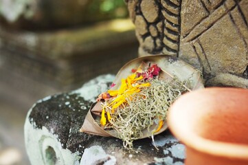 Offerings of flowers and incense sticks at Pura Tirta Empul, the Hindu Holy Water Temple, near Tampaksiring — Bali, Indonesia