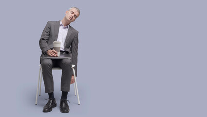 Businessman sitting on a chair and sleeping
